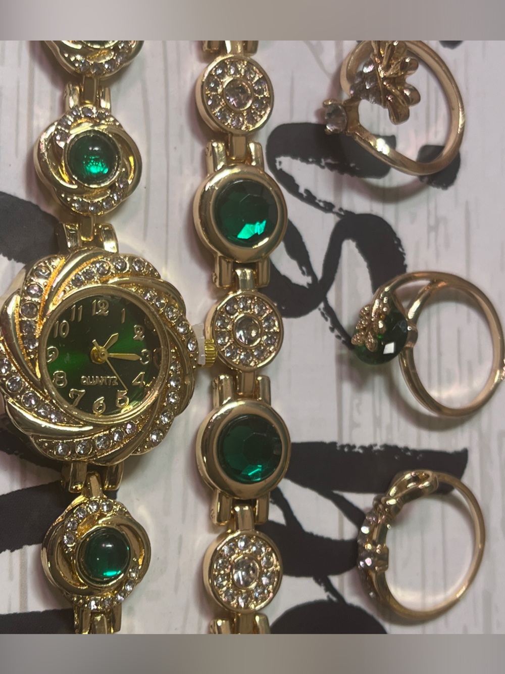 Elegant Gold-Tone Women's Bracelet Watch set with Emerald Green Accents